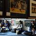 From left, Michigan junior Courtney Lantzer, Ohio, junior Matt Simpson, Lansing, sophomore Gabby Gutierrez, Woodhaven, and alumni Jeffrey Groom, Utica, sit on the floor as they wait in line for a chance to meet Desmond Howard during an autograph signing at the M Den on Friday.  Melanie Maxwell I AnnArbor.com